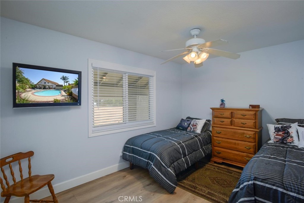 10424 Cartilla Court Rancho Cucamonga, CA 91737 - Photo 20 of 36 a bedroom with a bed and wooden floor