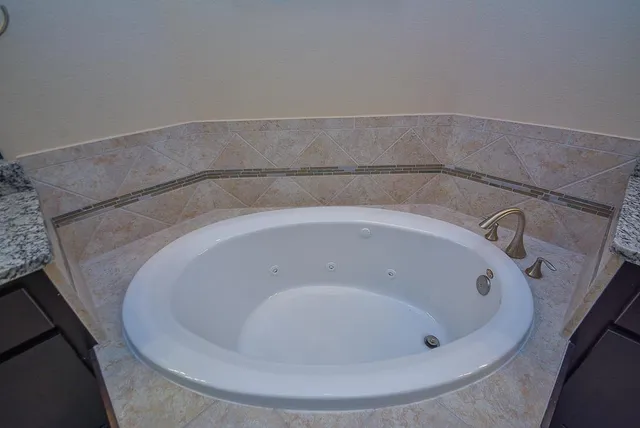 a room with a white cabinets and a window