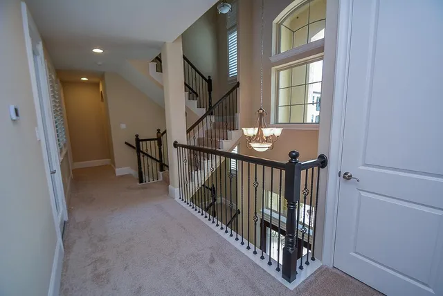 a view of a livingroom with stairs and stairs