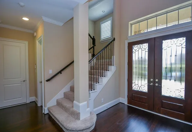 a view of entryway with wooden floor and door