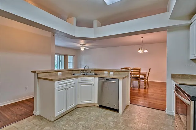 a kitchen with stainless steel appliances granite countertop a stove and a sink