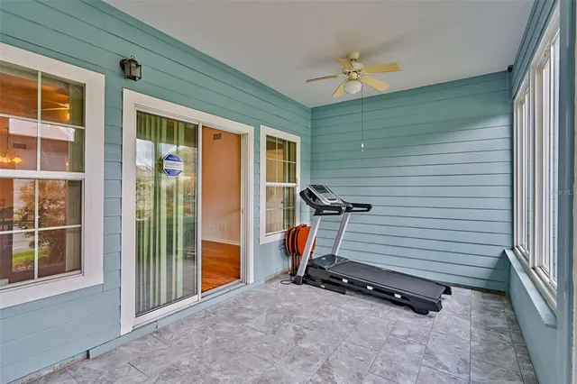 a view of a livingroom with furniture and a ceiling fan
