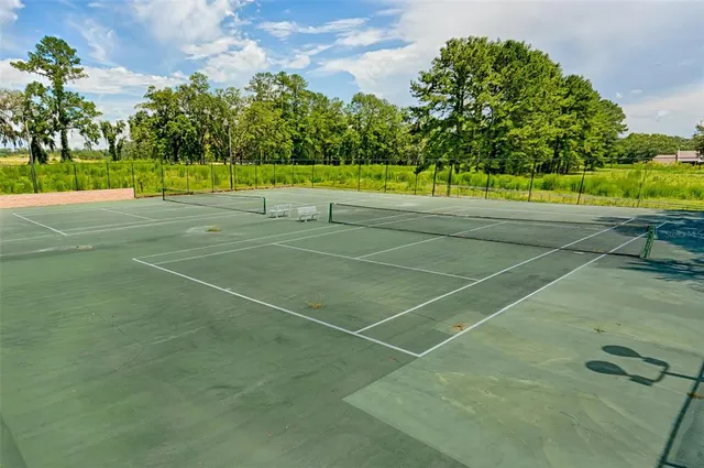 a view of an outdoor space and tennis court