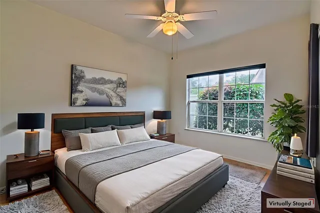 a bedroom with bed and window