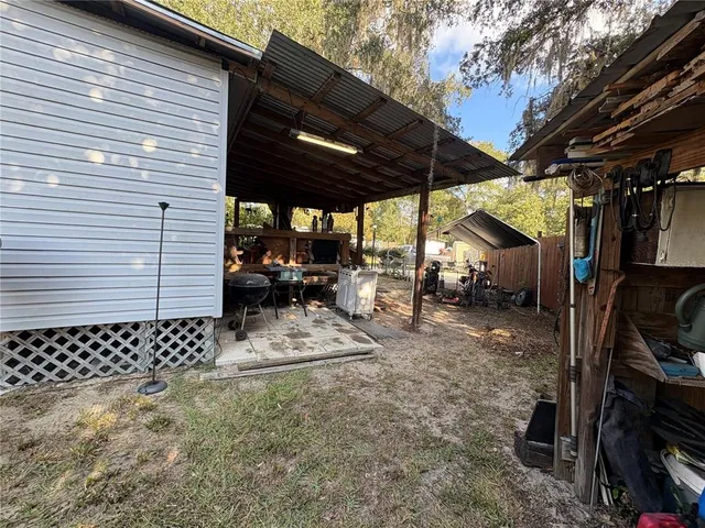 a view of outdoor space and wooden deck