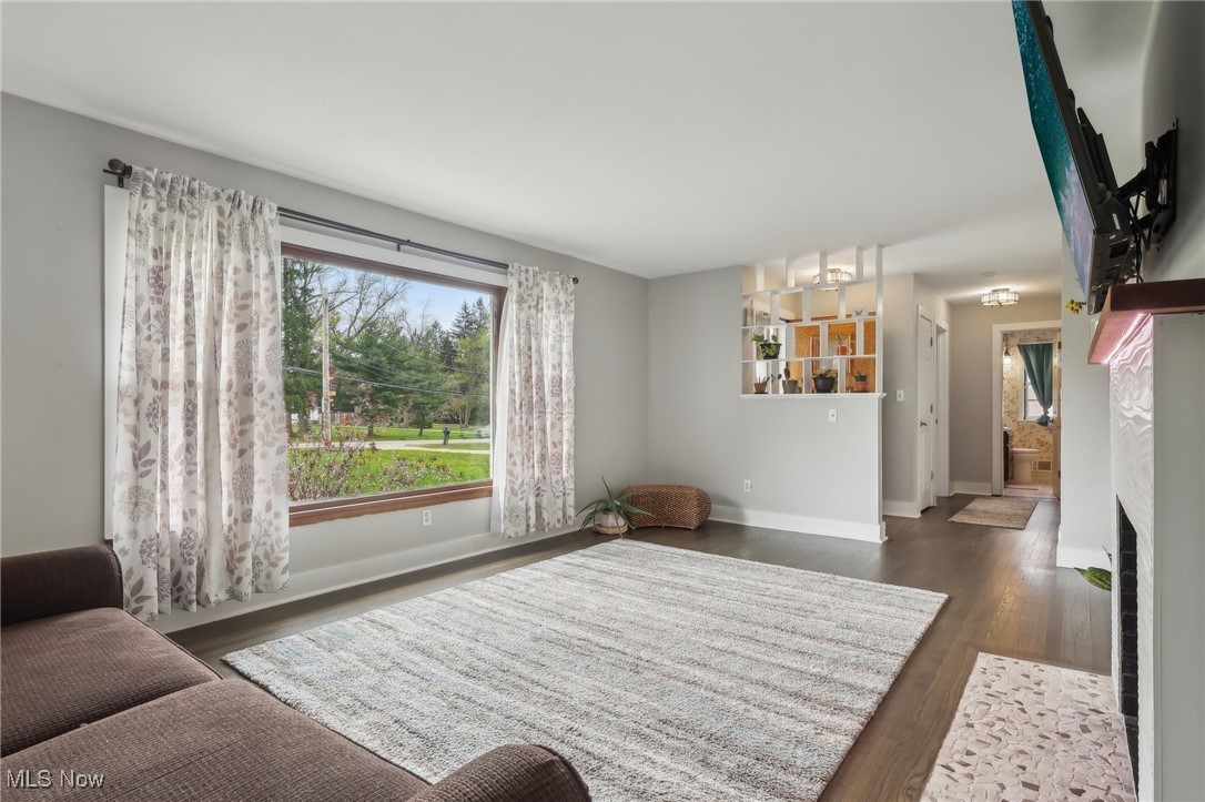 13676 Whitney Road Strongsville, OH 44136 - Photo 7 of 46 Living area featuring baseboards and wood finished floors