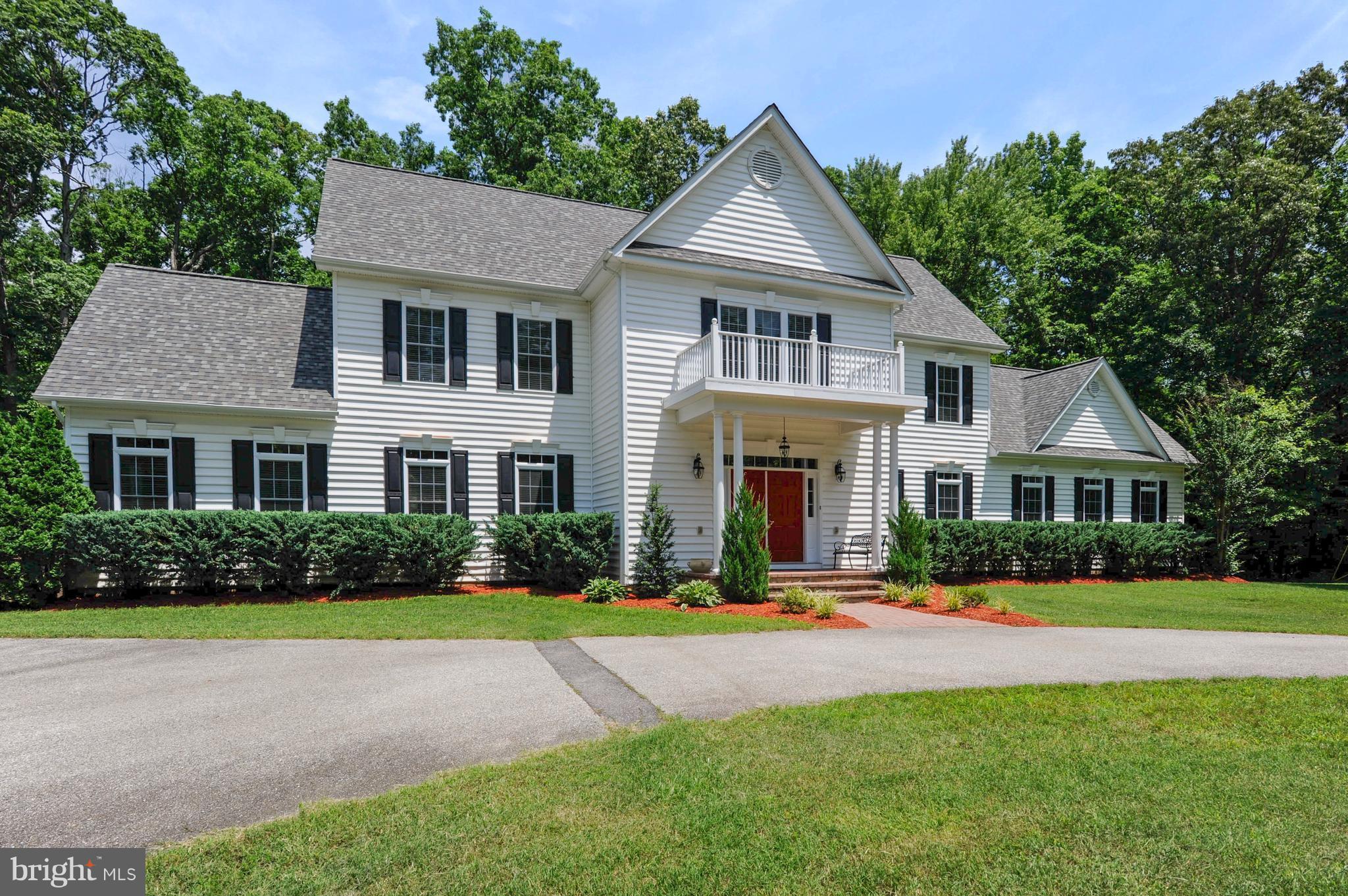 9440 Billingsley Road White Plains, MD 20695 - Photo 1 of 30 a front view of a house with a yard