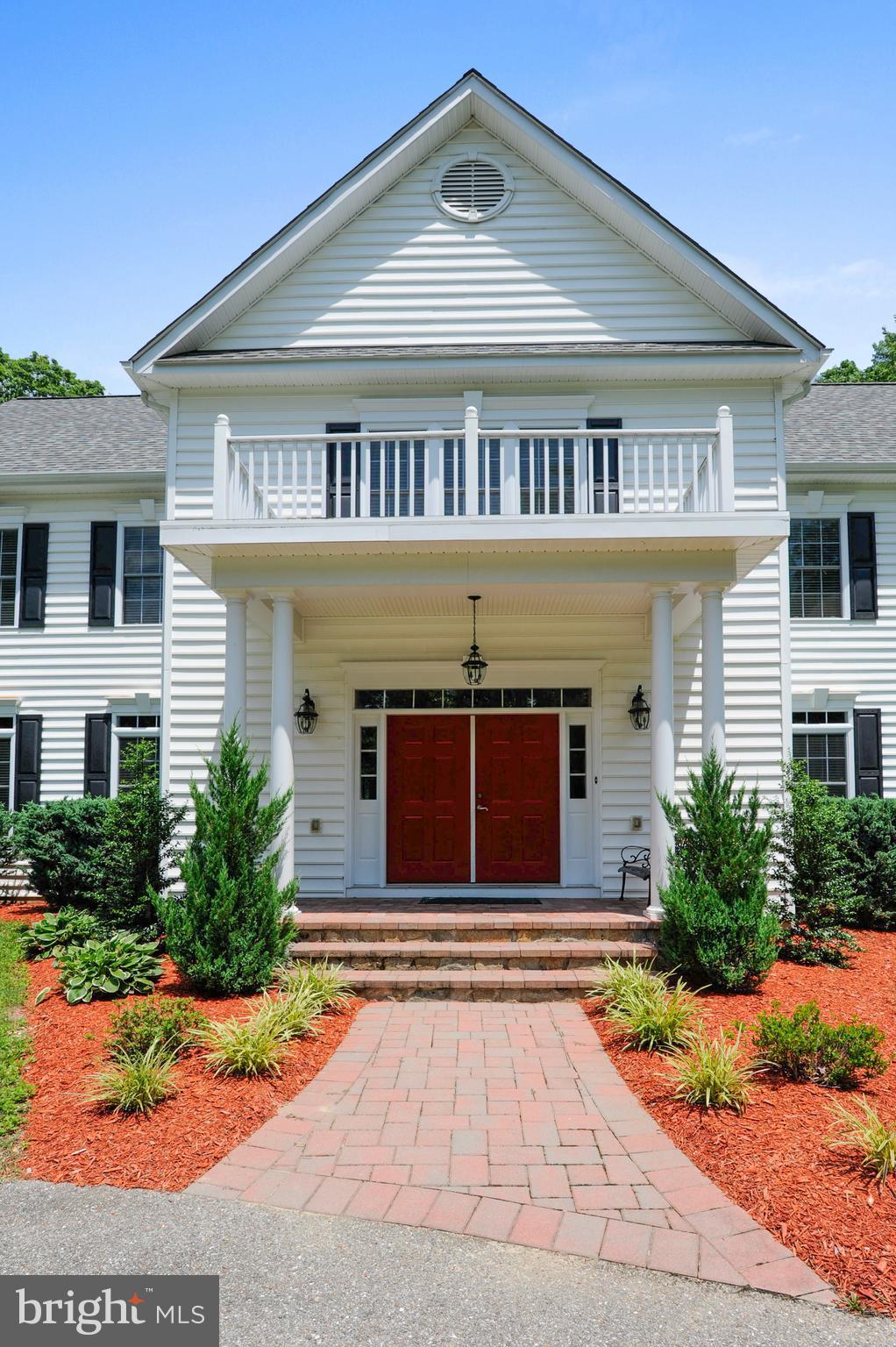 9440 Billingsley Road White Plains, MD 20695 - Photo 2 of 30 a front view of a house with a yard