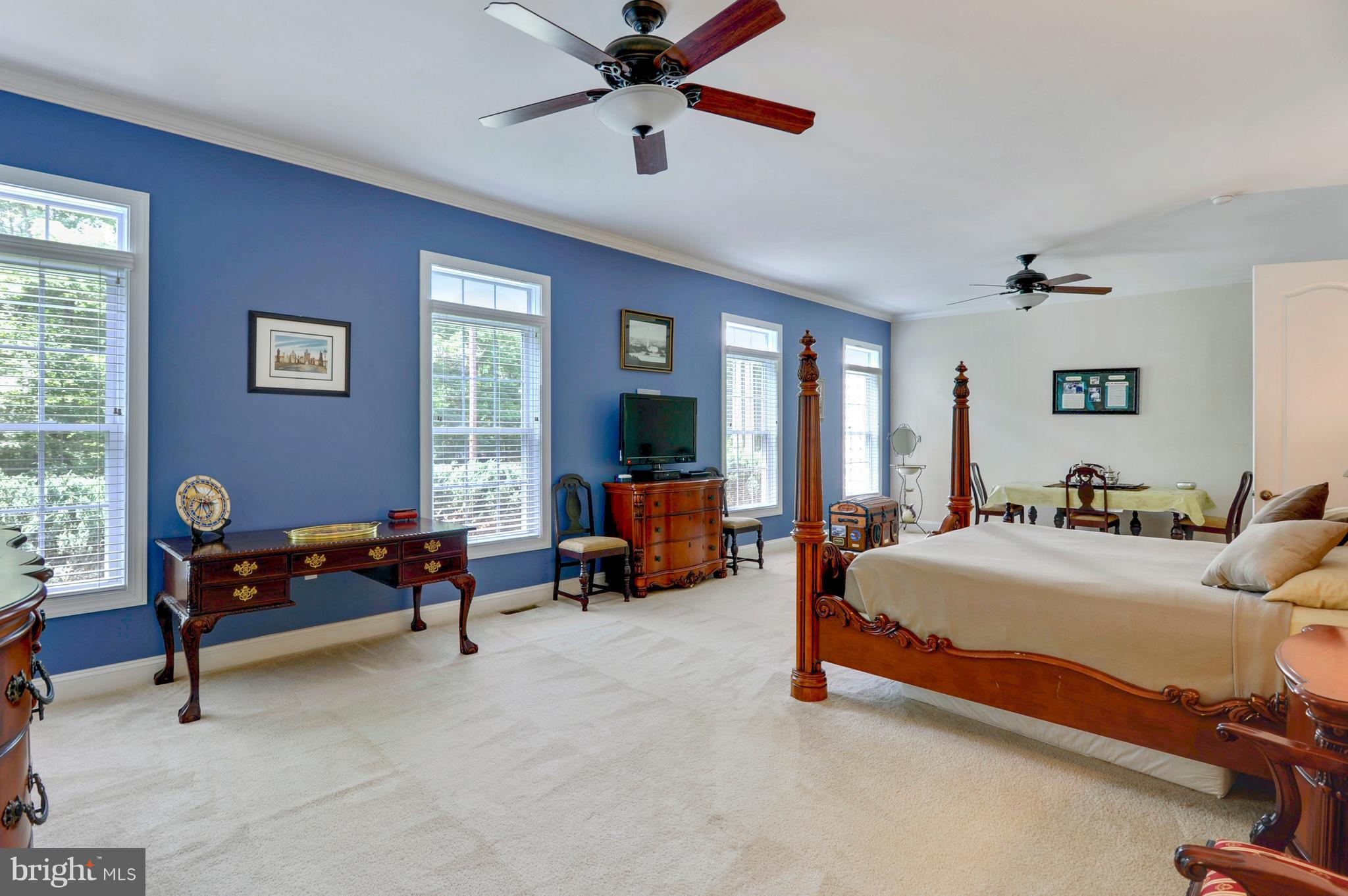 9440 Billingsley Road White Plains, MD 20695 - Photo 12 of 30 a bedroom with bed and a chandelier