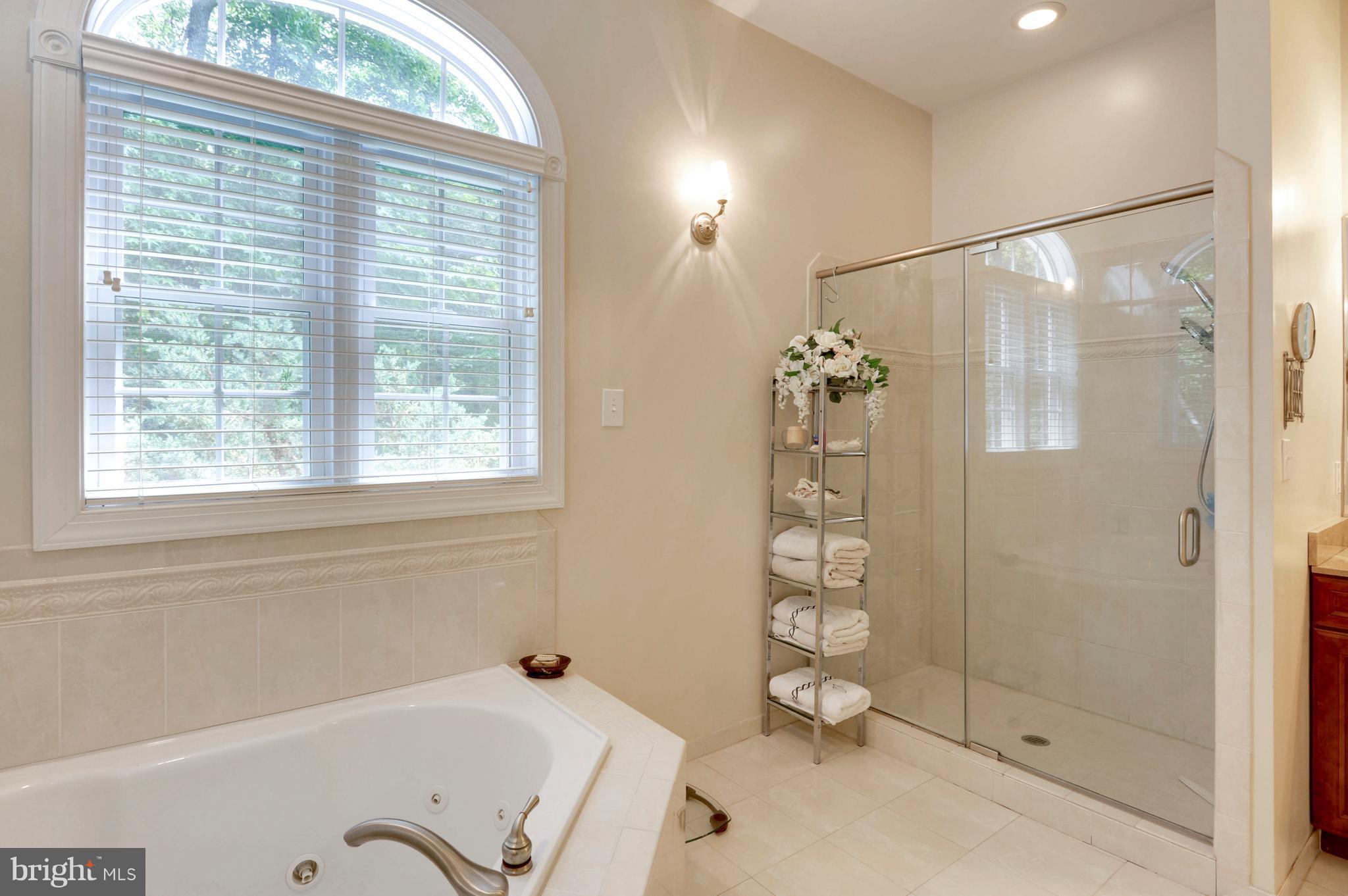 9440 Billingsley Road White Plains, MD 20695 - Photo 16 of 30 a bathroom with a bathtub and shower