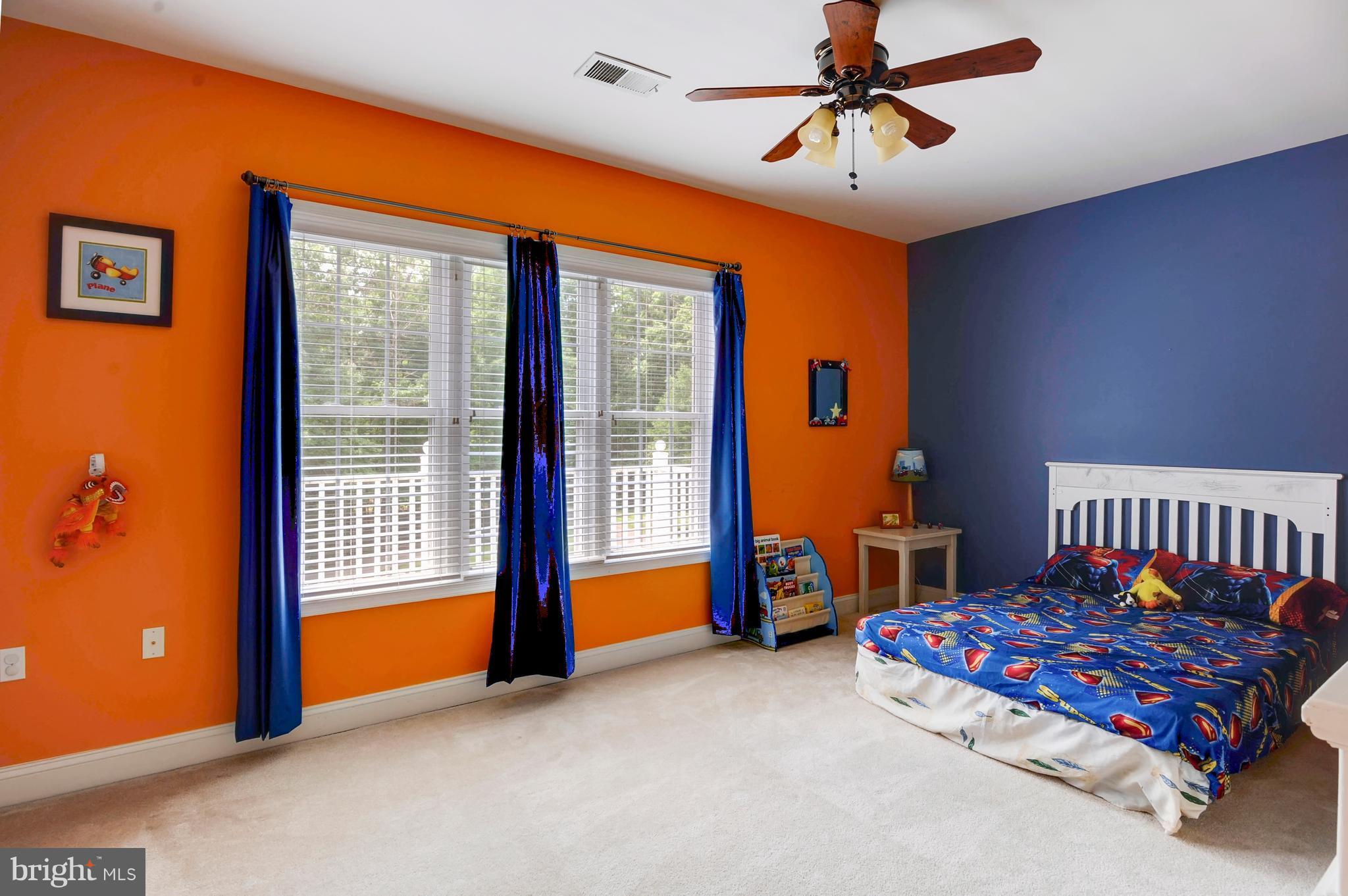 9440 Billingsley Road White Plains, MD 20695 - Photo 19 of 30 a bedroom with furniture and a chandelier