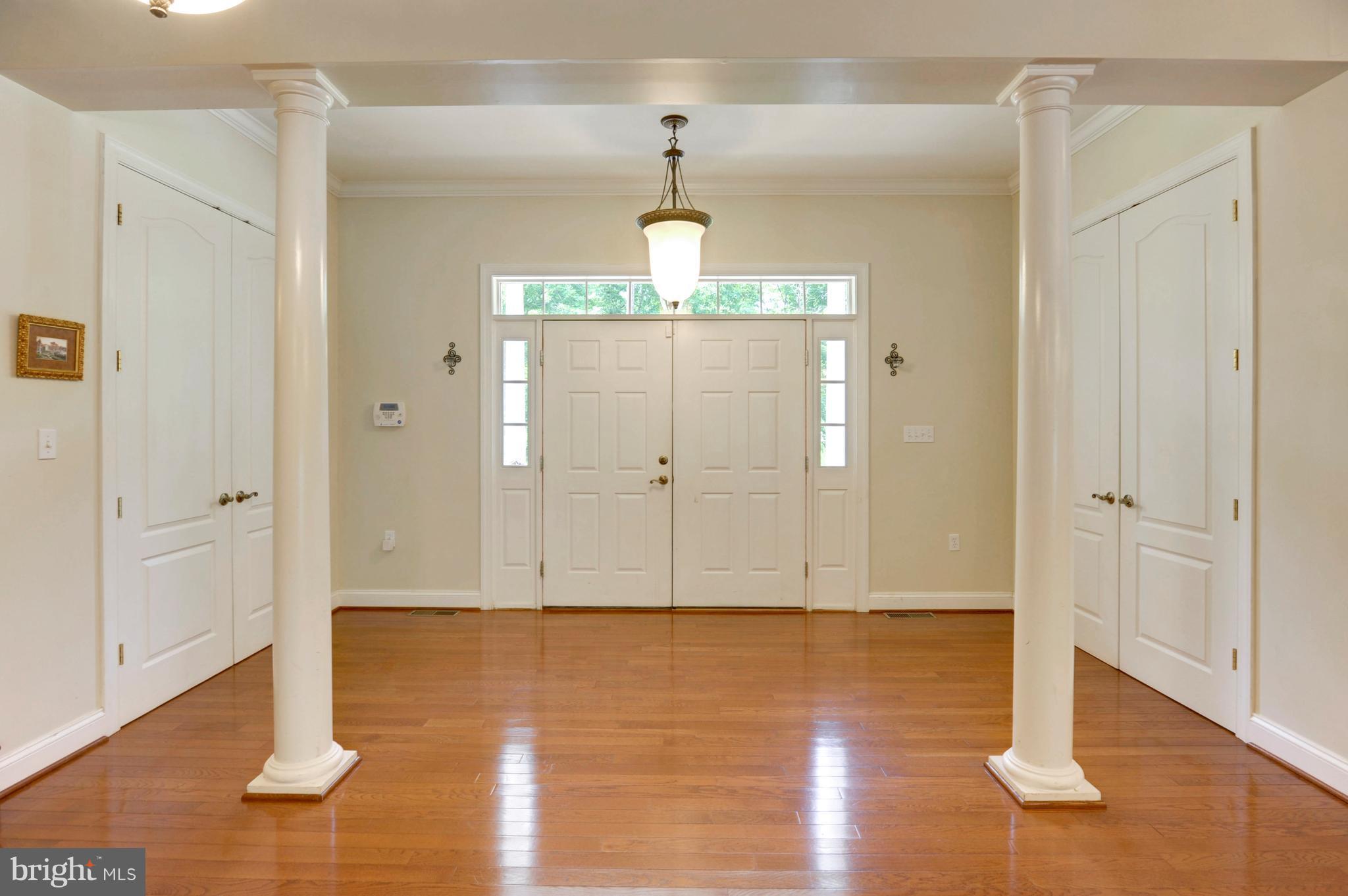 9440 Billingsley Road White Plains, MD 20695 - Photo 3 of 30 a view of a room with wooden floor closet and windows