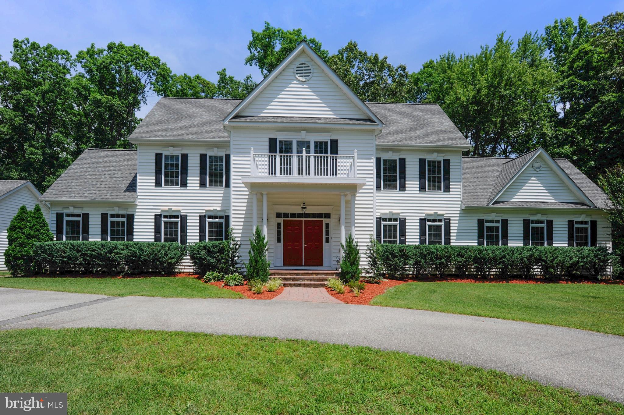 9440 Billingsley Road White Plains, MD 20695 - Photo 27 of 30 a front view of a house with yard and green space