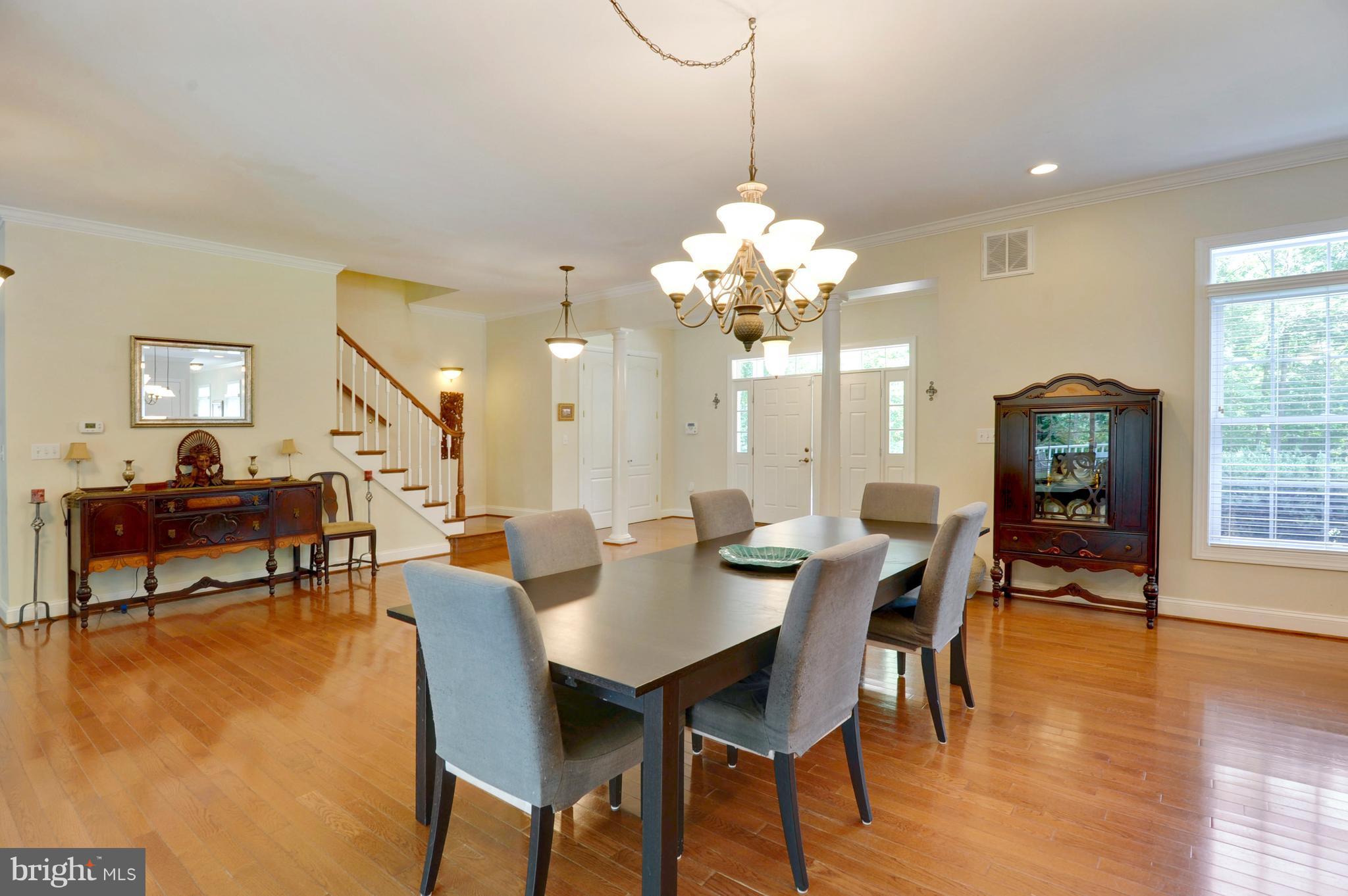 9440 Billingsley Road White Plains, MD 20695 - Photo 7 of 30 a view of a dining room with furniture and wooden floor