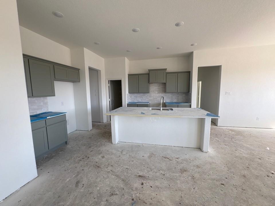 780 County Road 200 Valley View, TX 76272 - Photo 3 of 8 a view of kitchen with stainless steel appliances granite countertop a sink a stove top oven a refrigerator and white cabinets