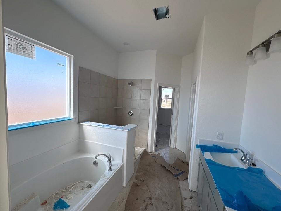 780 County Road 200 Valley View, TX 76272 - Photo 6 of 8 a bathroom with a bathtub and shower