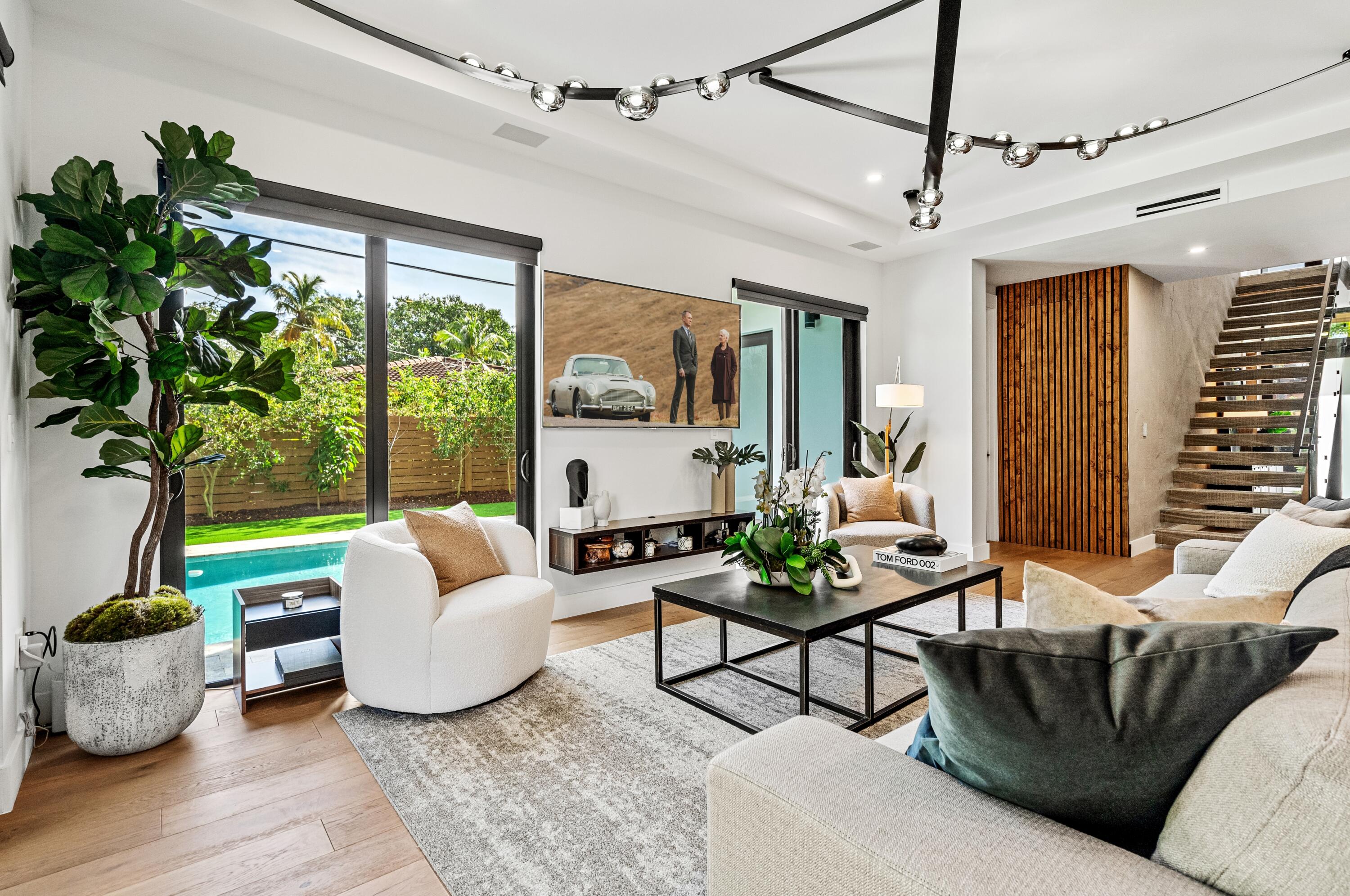 709 Northwest 6th Drive Boca Raton, FL 33486 - Photo 12 of 45 a living room with patio furniture and a potted plant