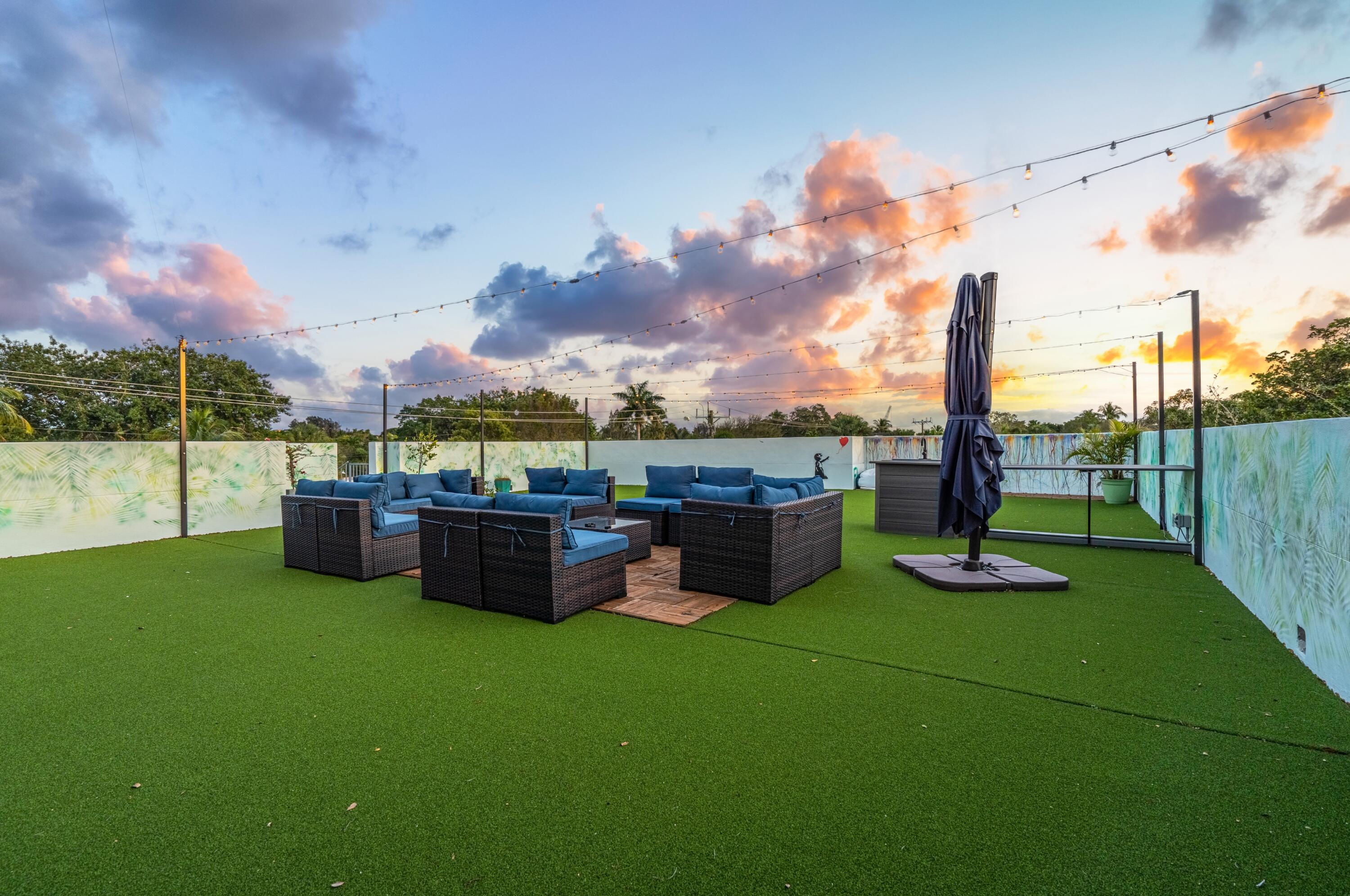 709 Northwest 6th Drive Boca Raton, FL 33486 - Photo 31 of 45 a view of a backyard with sitting area