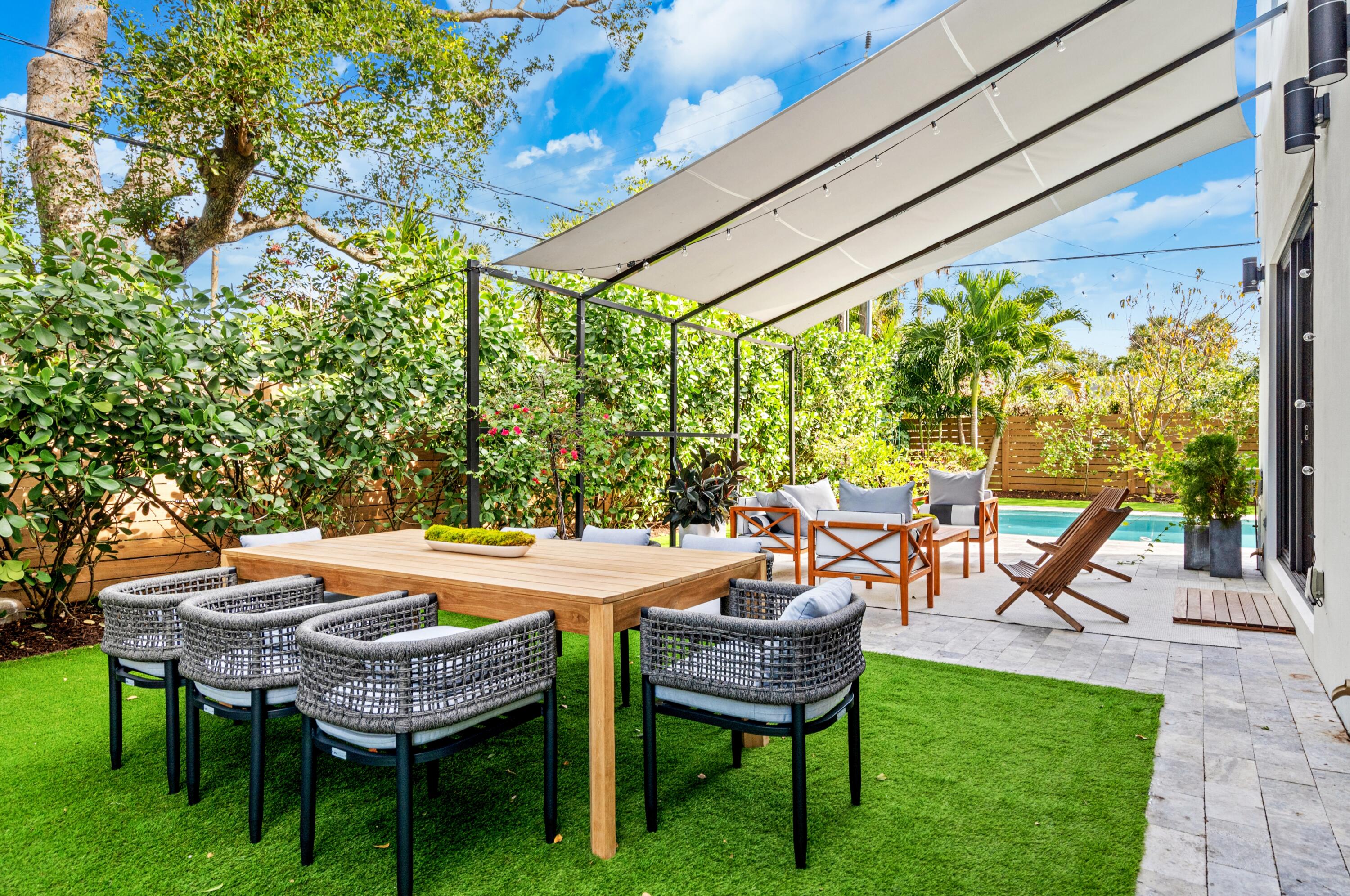 709 Northwest 6th Drive Boca Raton, FL 33486 - Photo 38 of 45 a backyard of a house with outdoor seating