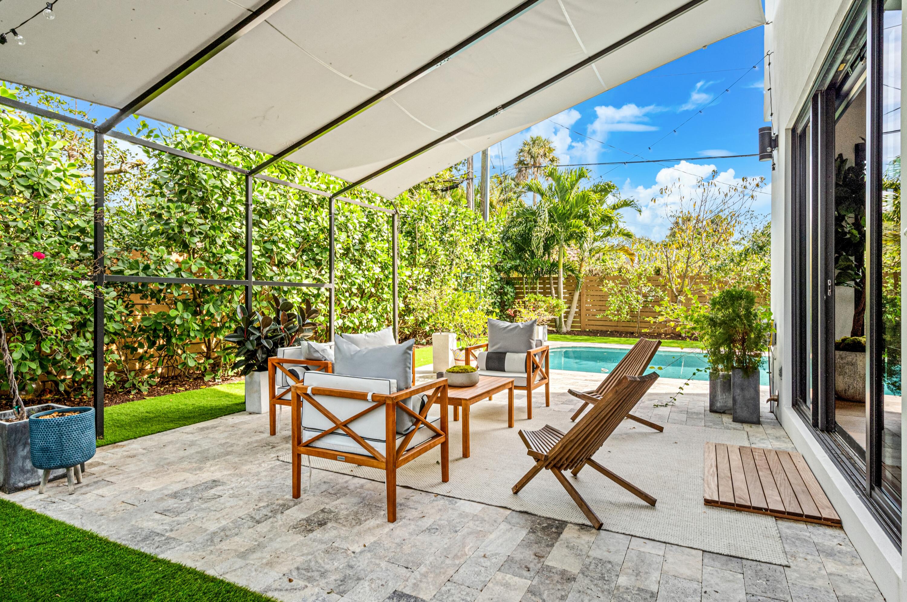 709 Northwest 6th Drive Boca Raton, FL 33486 - Photo 39 of 45 a view of a patio with a table and chairs