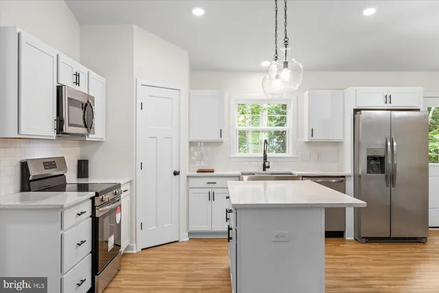 a view of a hallway with a window