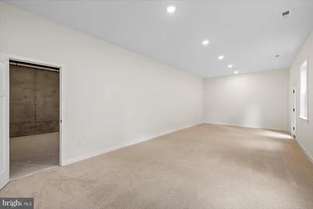 a swimming pool with trees in the background