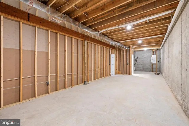 a front view of a house with a yard and lake view