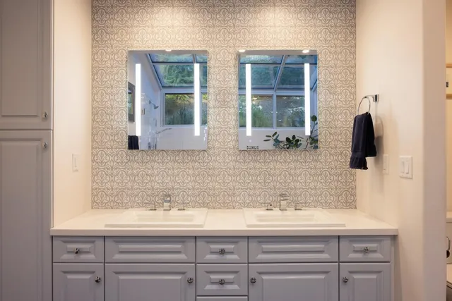 a bathroom with a sink and a mirror