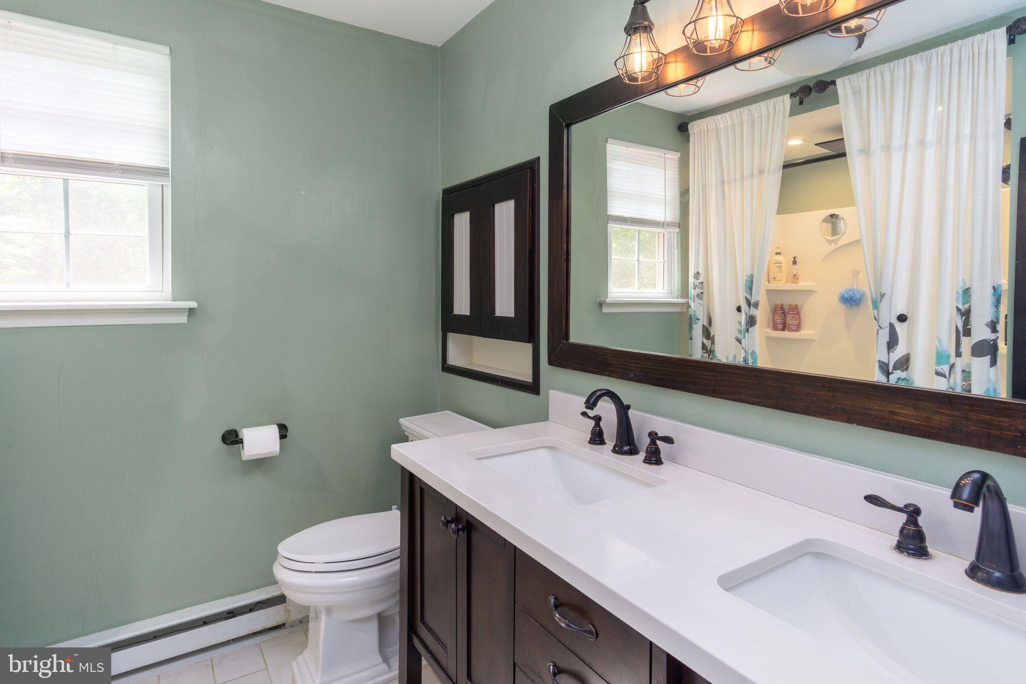 454 Moyer Road Harleysville, PA 19438 - Photo 15 of 35 Full bathroom with double sinks, tubshower combo