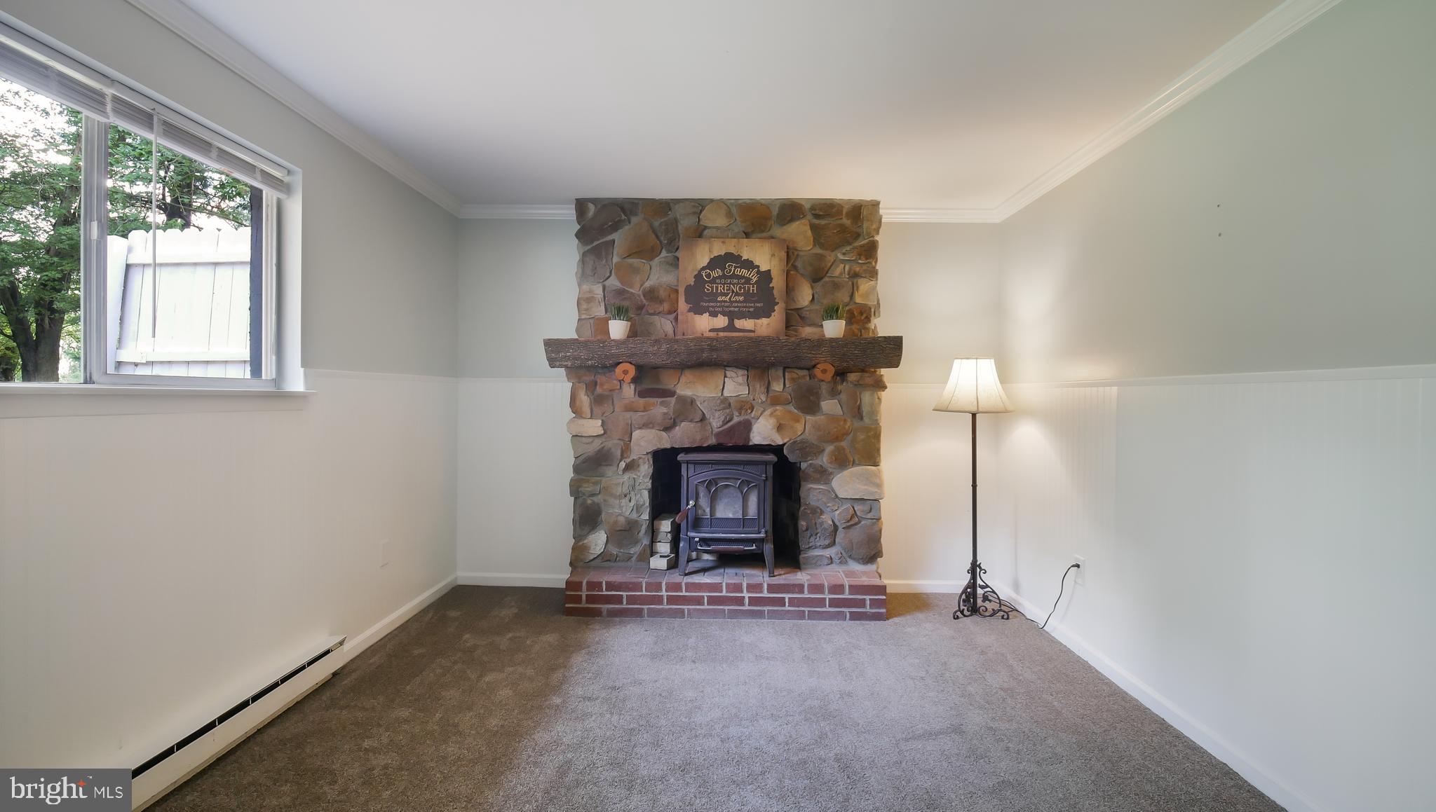 454 Moyer Road Harleysville, PA 19438 - Photo 26 of 35 Family room fireplace with woodburning insert