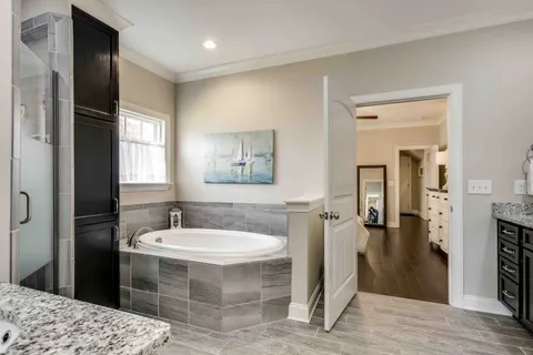 a bathroom with a shower and a sink