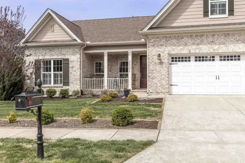 a front view of a house with garden