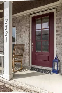 a view of a door and a window