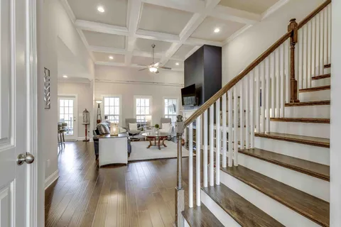 a living room with fireplace furniture and a flat screen tv