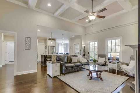 a living room with furniture fireplace and flat screen tv