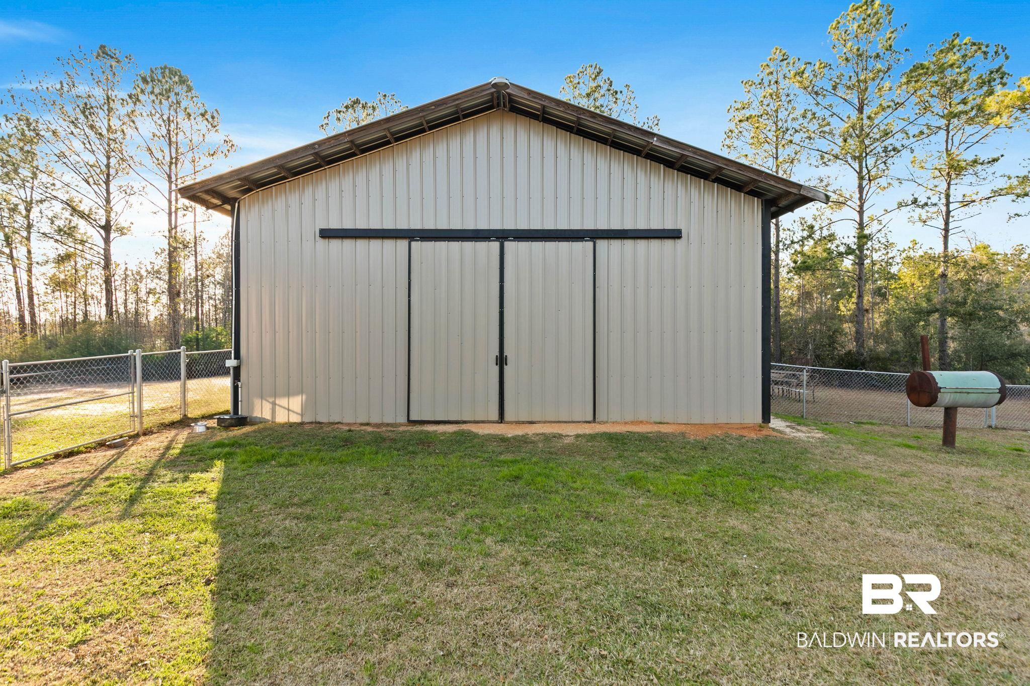 55750 Lottie Road Perdido, AL 36562 - Photo 32 of 84 View of pole building with a gate