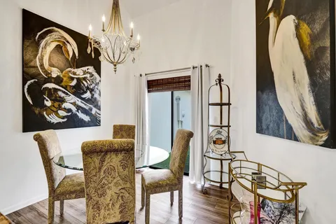 a large living room with stainless steel appliances granite countertop furniture and a view of living room