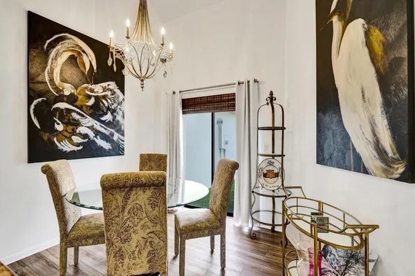 a large living room with stainless steel appliances granite countertop furniture and a view of living room