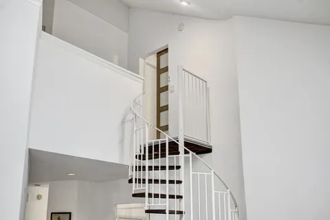 a view of a livingroom with washer and dryer