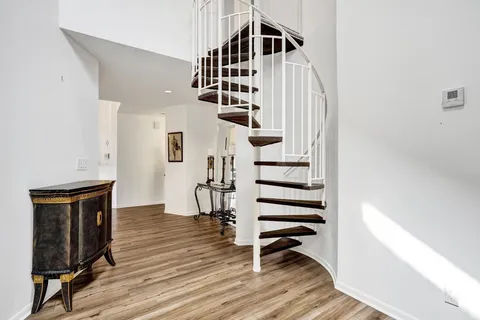 a bathroom with a sink a toilet and shower curtain