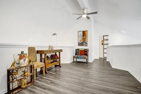a bathroom with a glass door shower and a sink