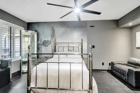 a view of a swimming pool with a chair and palm trees