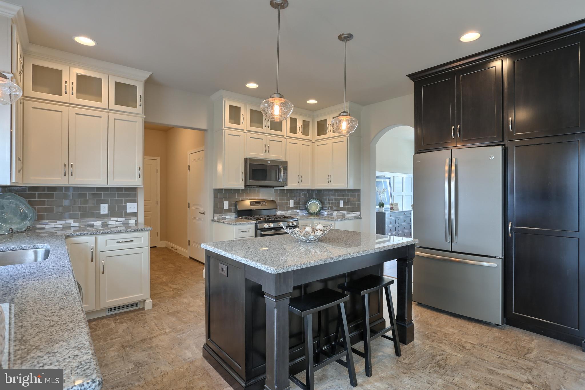 5 Rolling Meadow Road Lebanon, PA 17046 - Photo 20 of 35 a kitchen with refrigerator a sink and cabinets