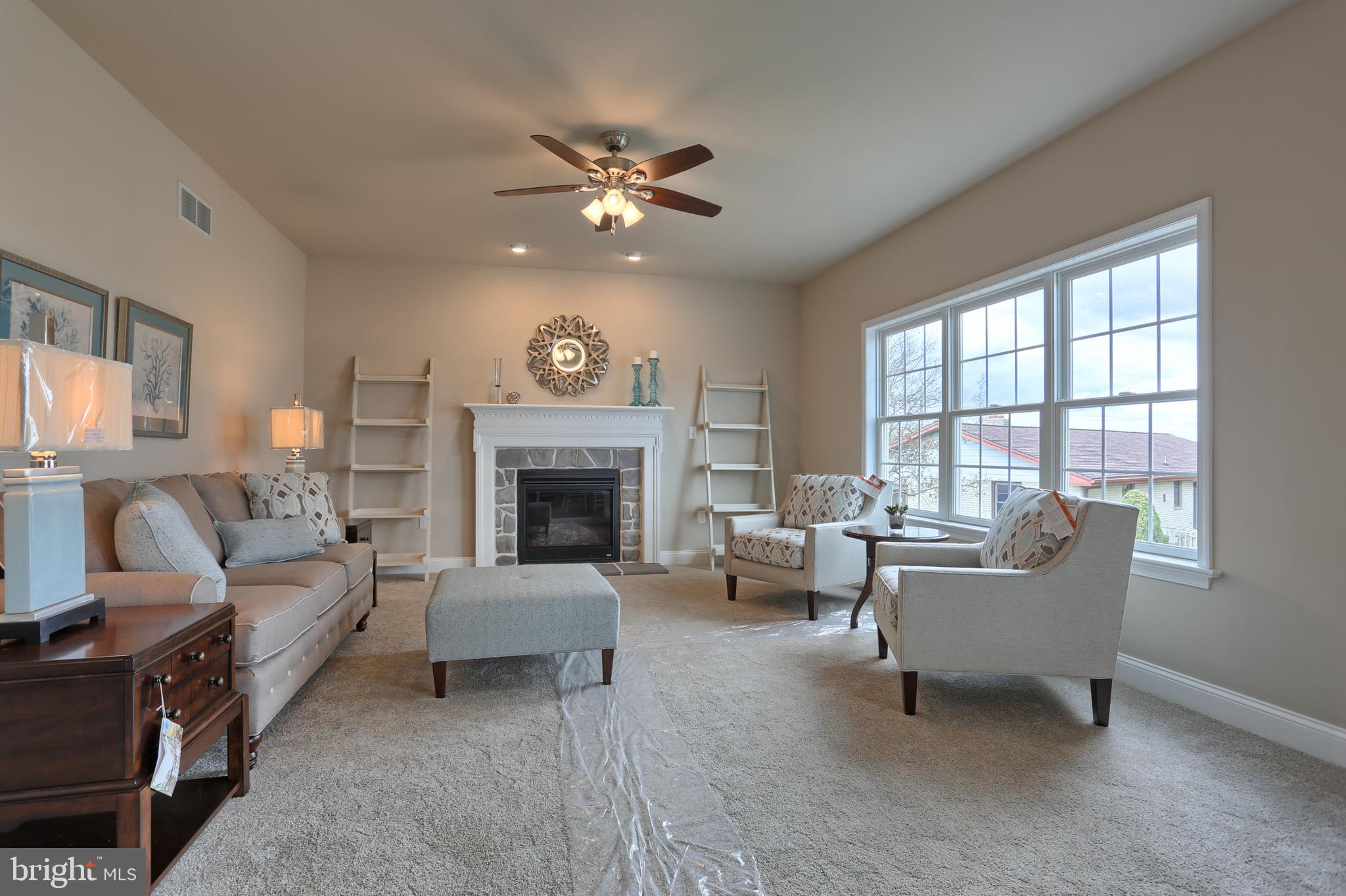 5 Rolling Meadow Road Lebanon, PA 17046 - Photo 27 of 35 a living room with furniture and a fireplace