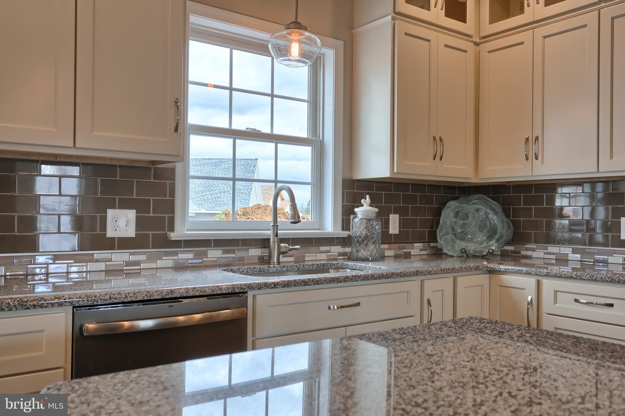 5 Rolling Meadow Road Lebanon, PA 17046 - Photo 29 of 35 a kitchen with granite countertop a sink stove and cabinets