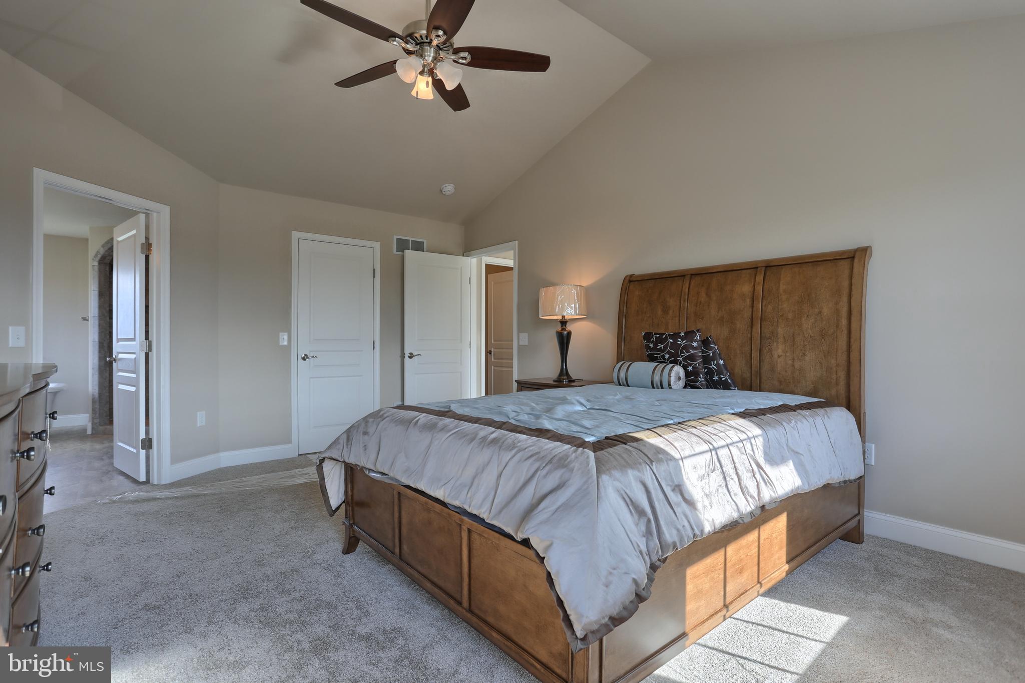 5 Rolling Meadow Road Lebanon, PA 17046 - Photo 31 of 35 a spacious bedroom with a bed and a chandelier
