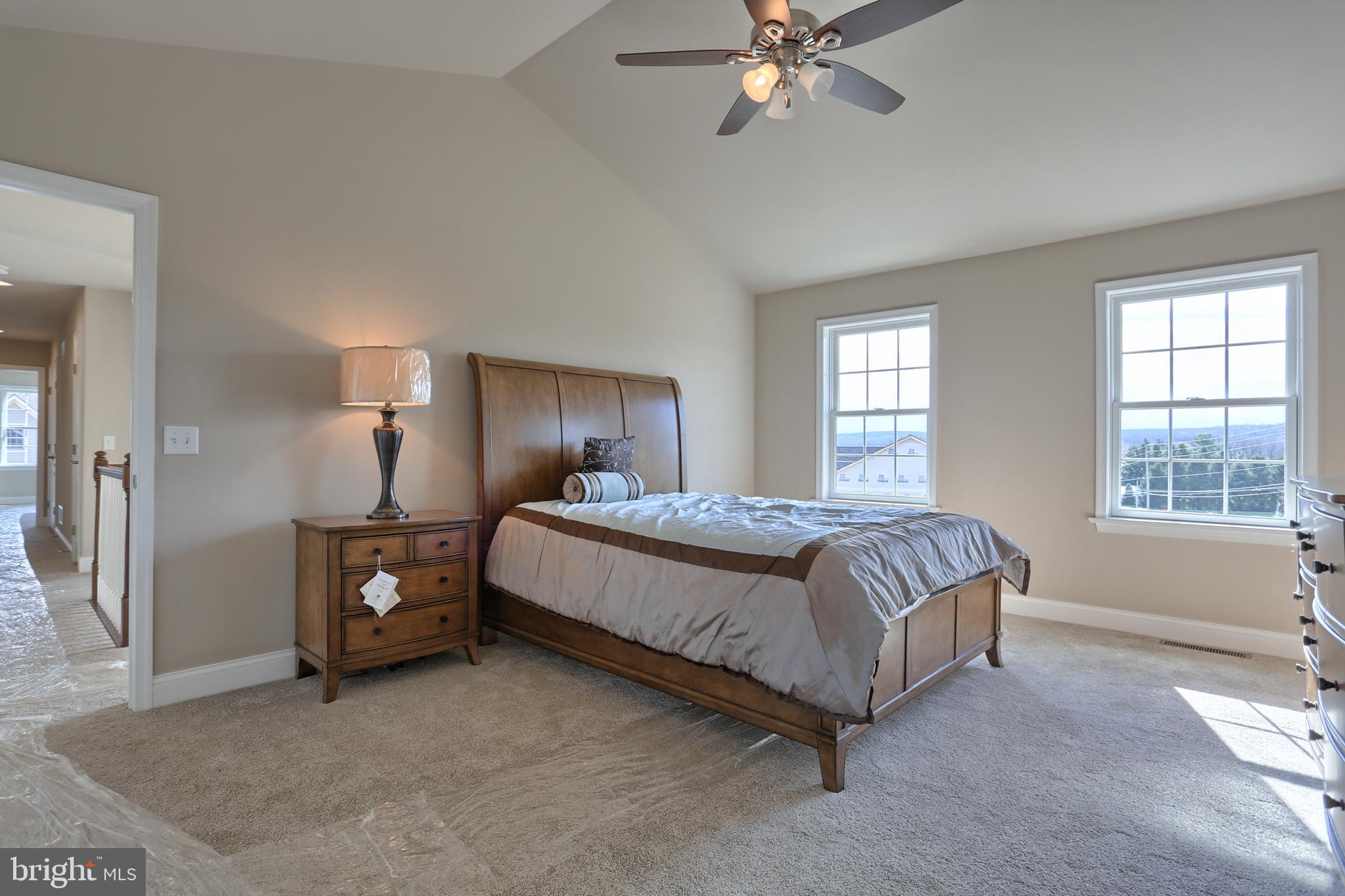 5 Rolling Meadow Road Lebanon, PA 17046 - Photo 35 of 35 a spacious bedroom with a bed and a chandelier