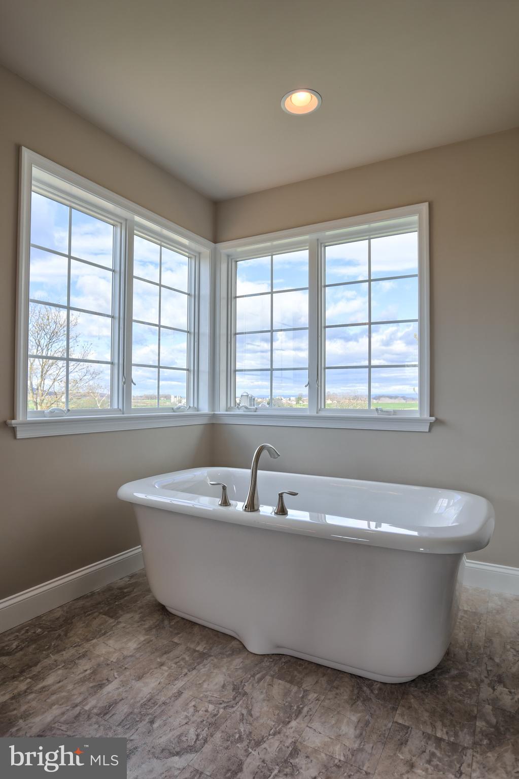 5 Rolling Meadow Road Lebanon, PA 17046 - Photo 6 of 35 a white bath tub sitting in a bathroom next to a window