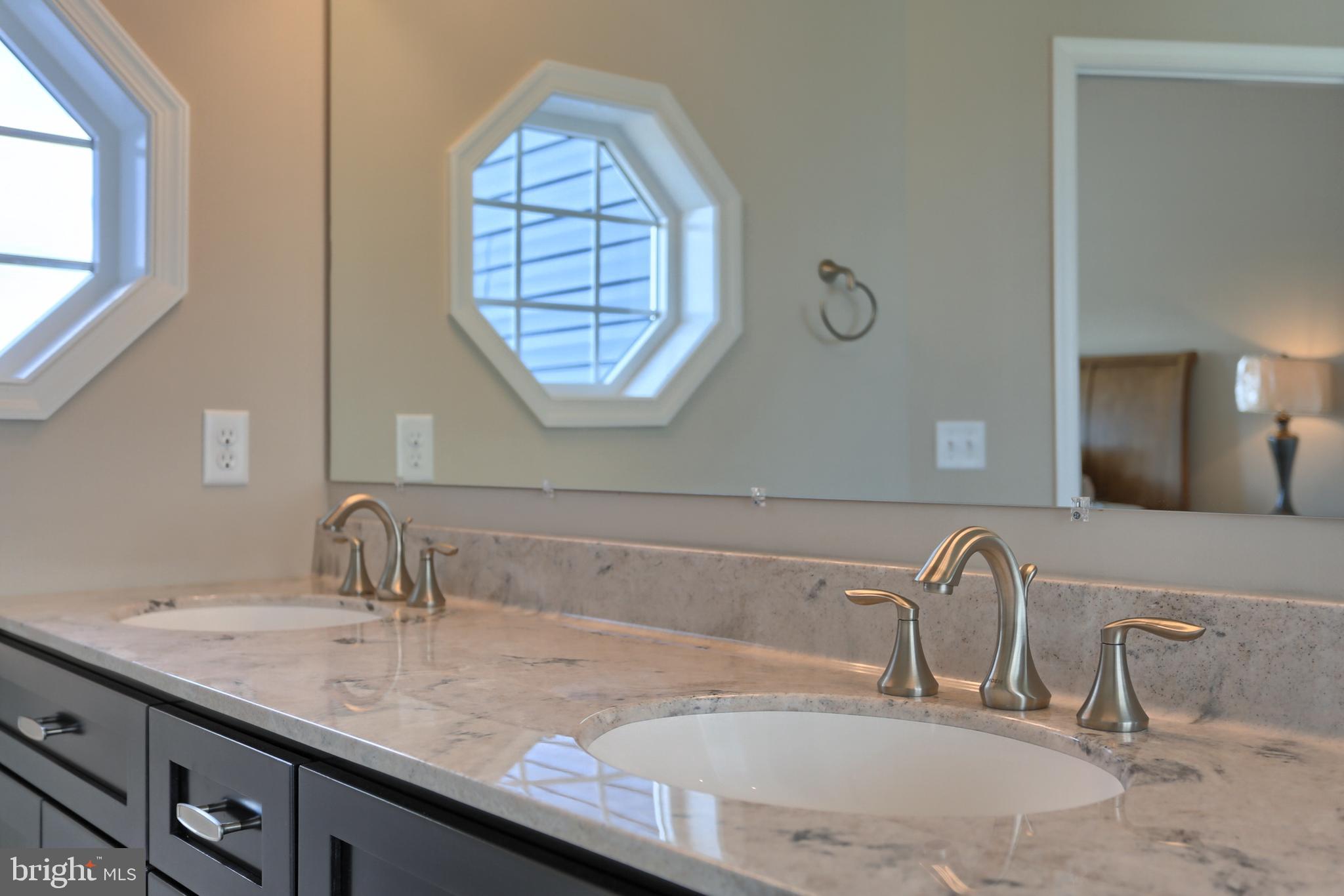 5 Rolling Meadow Road Lebanon, PA 17046 - Photo 8 of 35 a bathroom with a granite countertop double vanity sinks and a large mirror