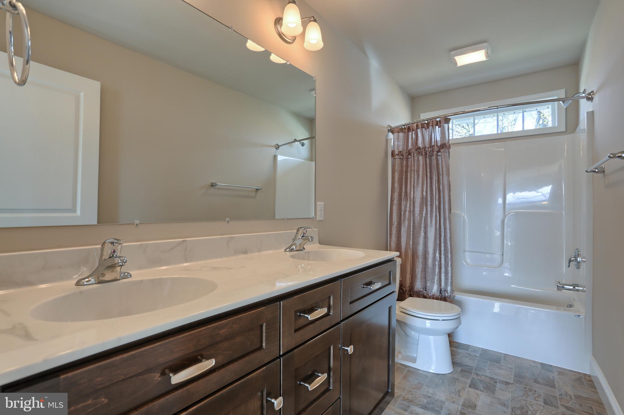 5 Rolling Meadow Road Lebanon, PA 17046 - Photo 9 of 35 a bathroom with a sink double vanity and a mirror